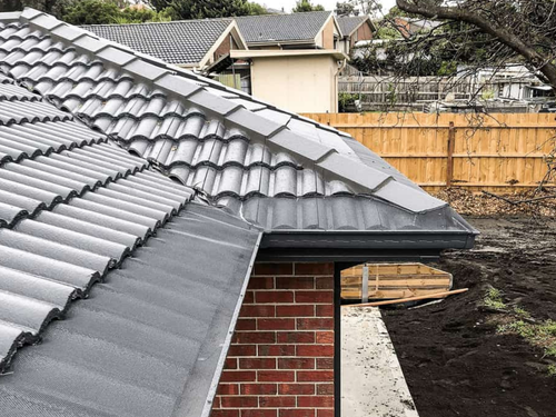 Tile roof gutter guard — solar panels