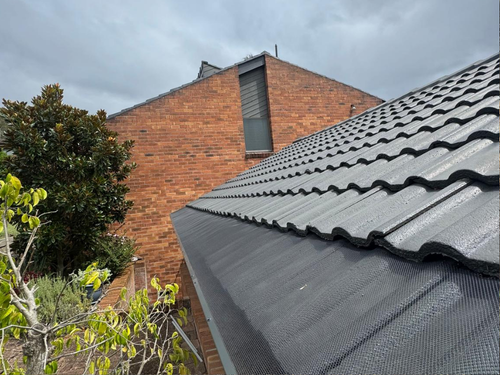 Aluminium mesh gutter guard on tile roof