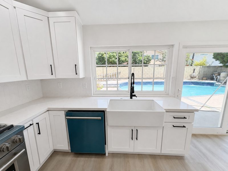 Kitchen &mdash; sink wall after renovation by KDI, Anegada