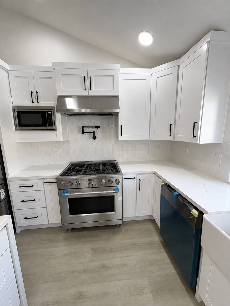 Kitchen &mdash; range wall after renovation by KDI, Anegada