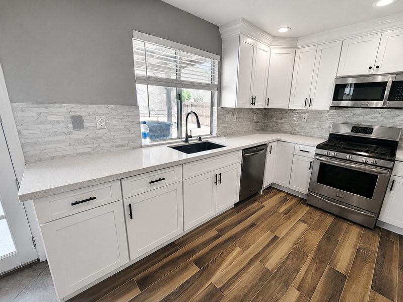 Kitchen &mdash; sink wall after renovation by KDI, Fairfield St.