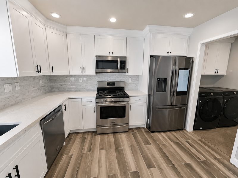 Kitchen &mdash; range wall after renovation by KDI, Fairfield St.