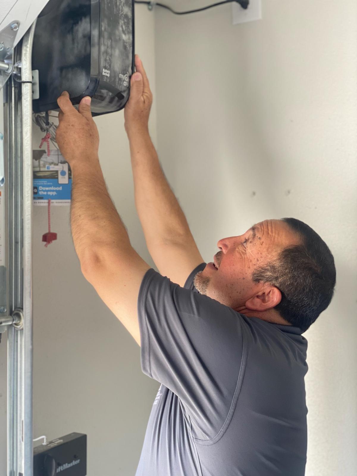 Quintana Garage Doors technician performing quality repair work