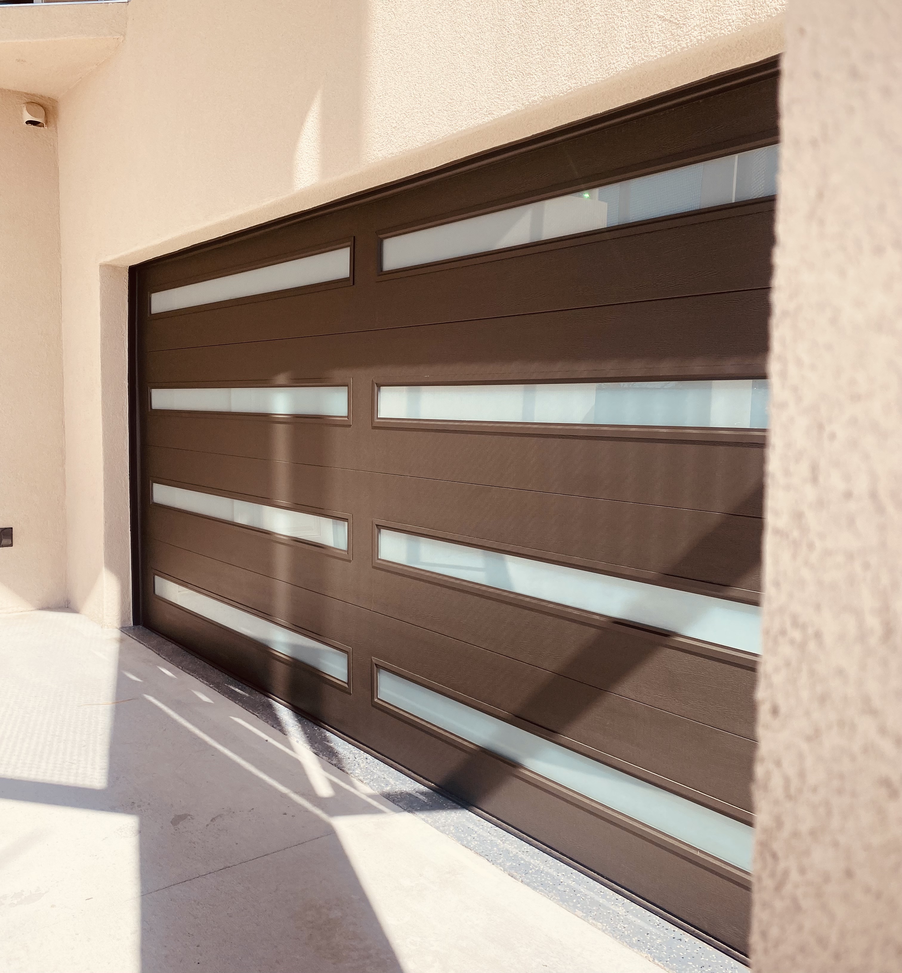 Newly installed modern garage door on a residential home