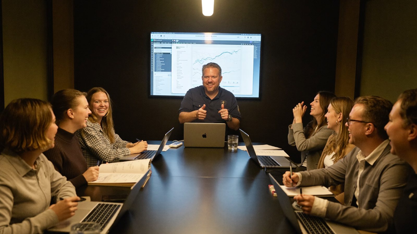 Eric leading a customer success team meeting