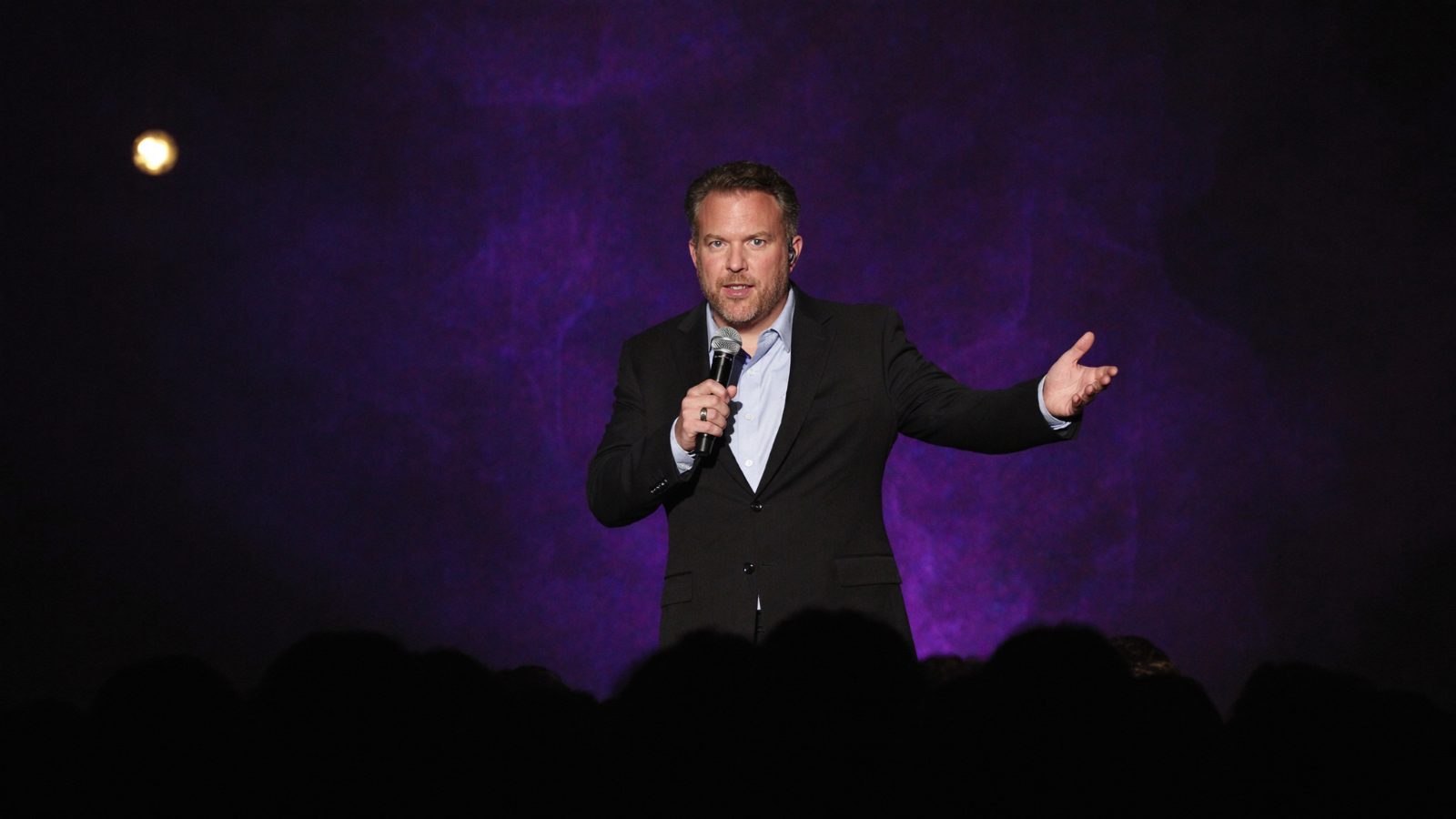 Eric Shirk speaking on stage