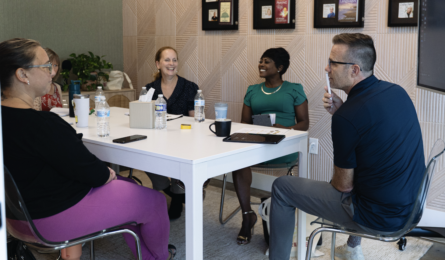 Brian Dixon coaching authors around a table