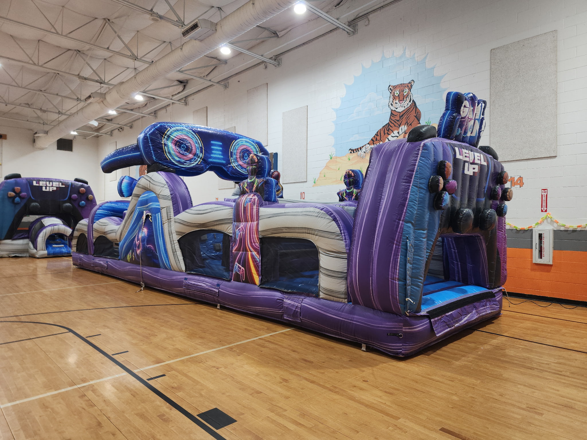 Kids racing through an inflatable obstacle course rental