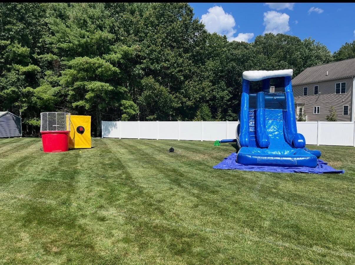 Bounce house and tent set up for a party