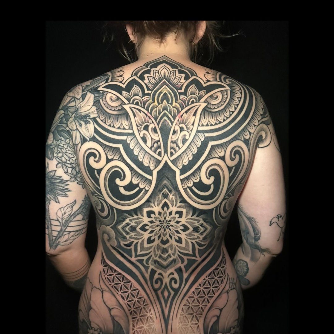 Colour tattoo sleeve by Santo Cuervo Tattoo Collective