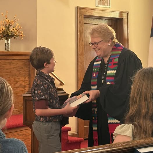 A kid who received his third-grade Bible in worship this week. He was thrilled.