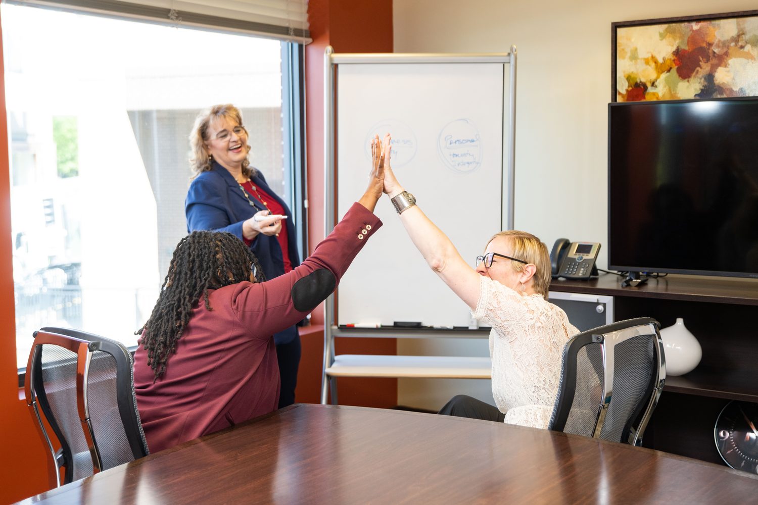 Mosaic Business Consulting clients celebrating a win with Laura Wagenknecht