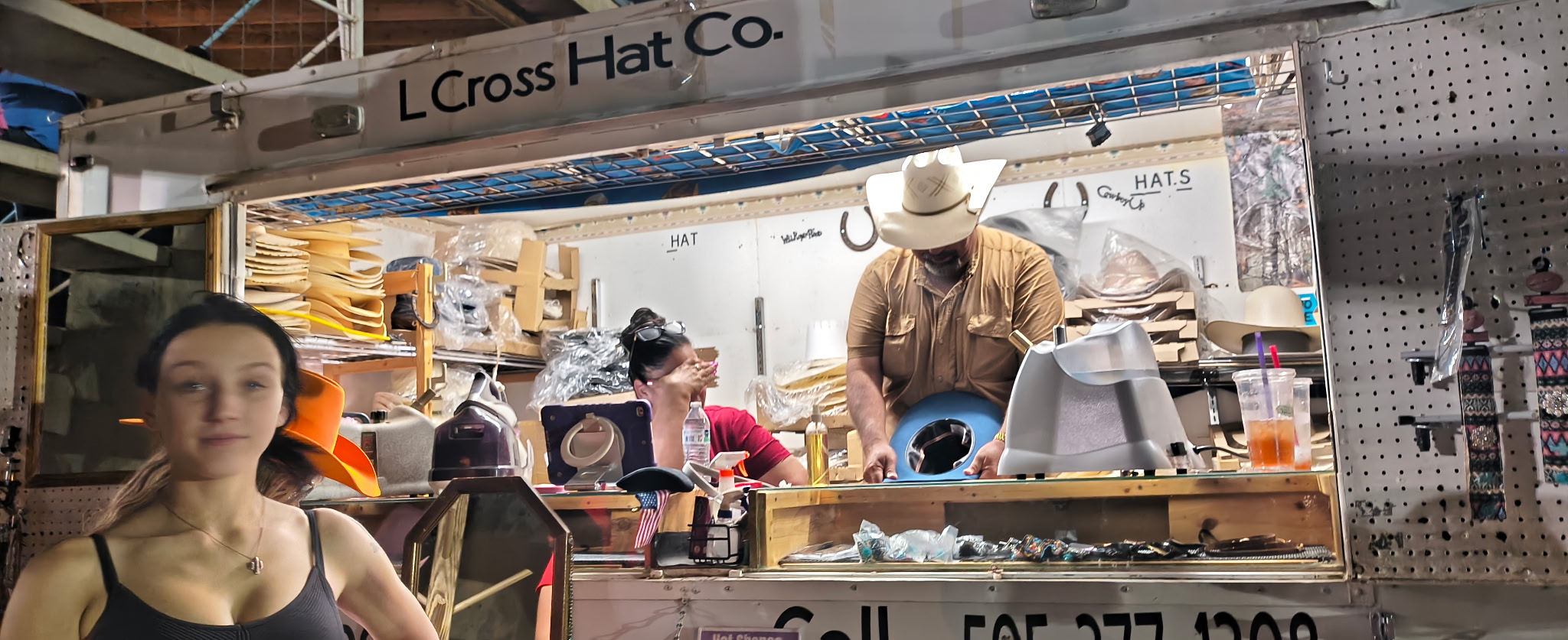 George Lopez shaping a hat