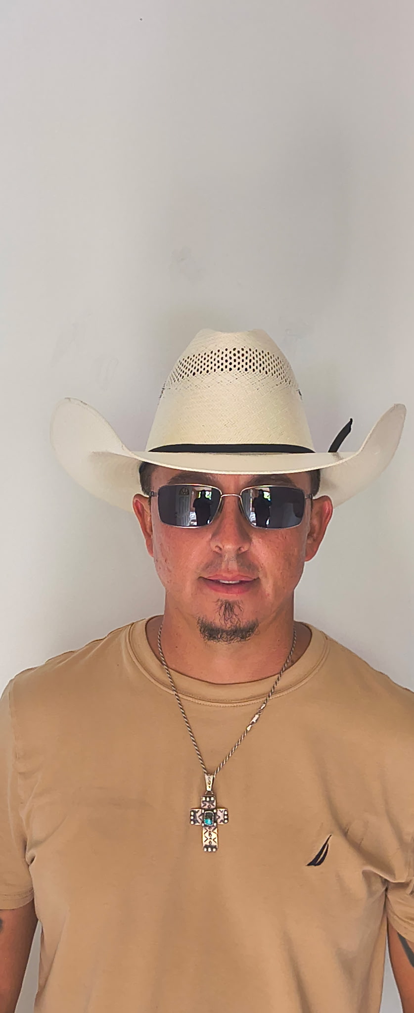 Wearing an L Cross hat