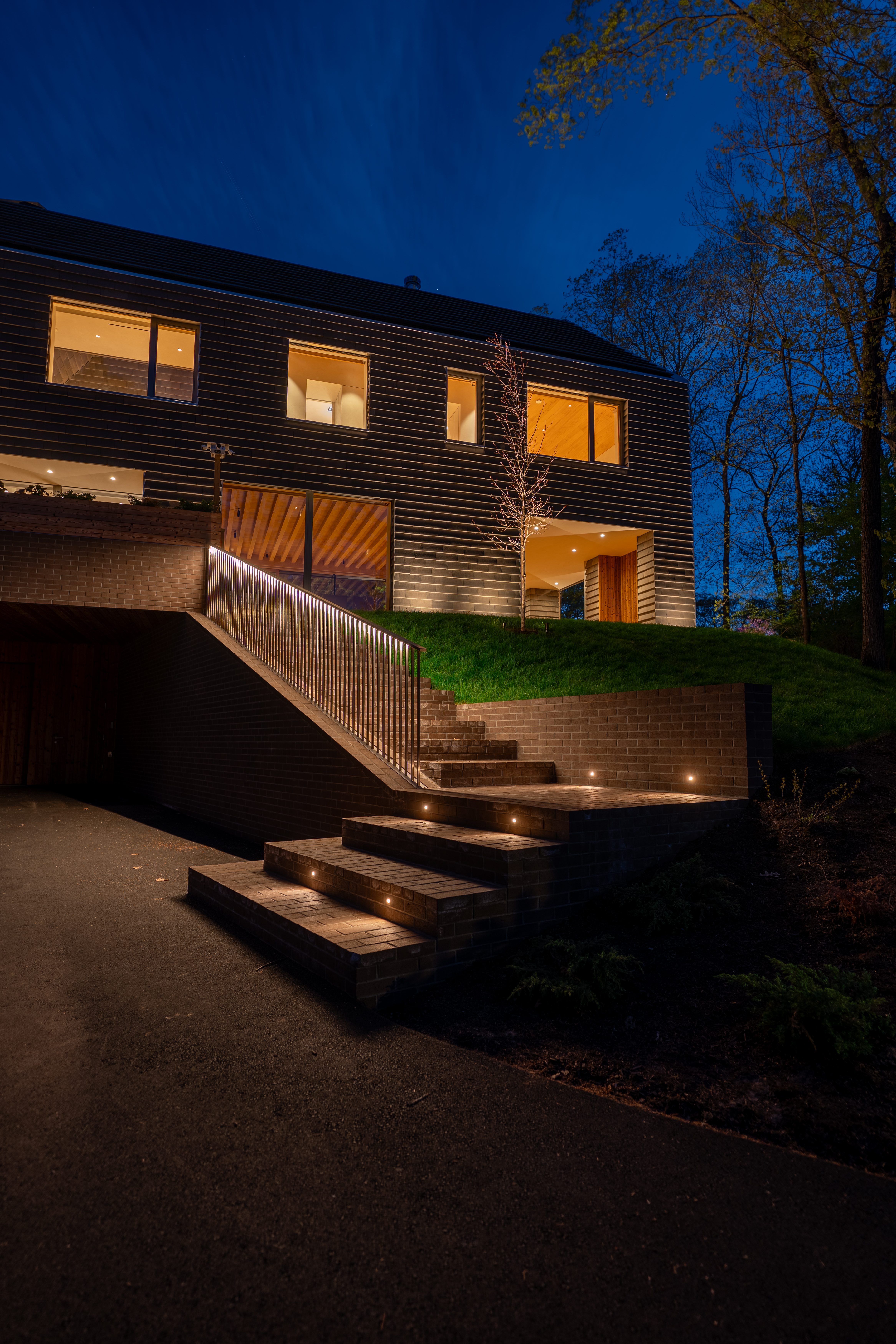 Close-up of lit stair and handrail craftsmanship