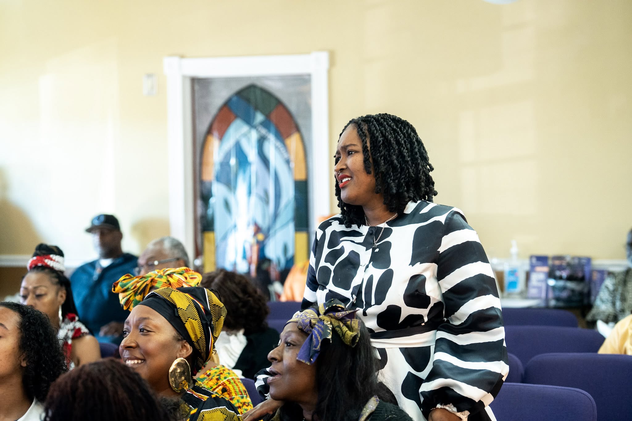 Women gathered around a table with open Bibles studying Scripture together