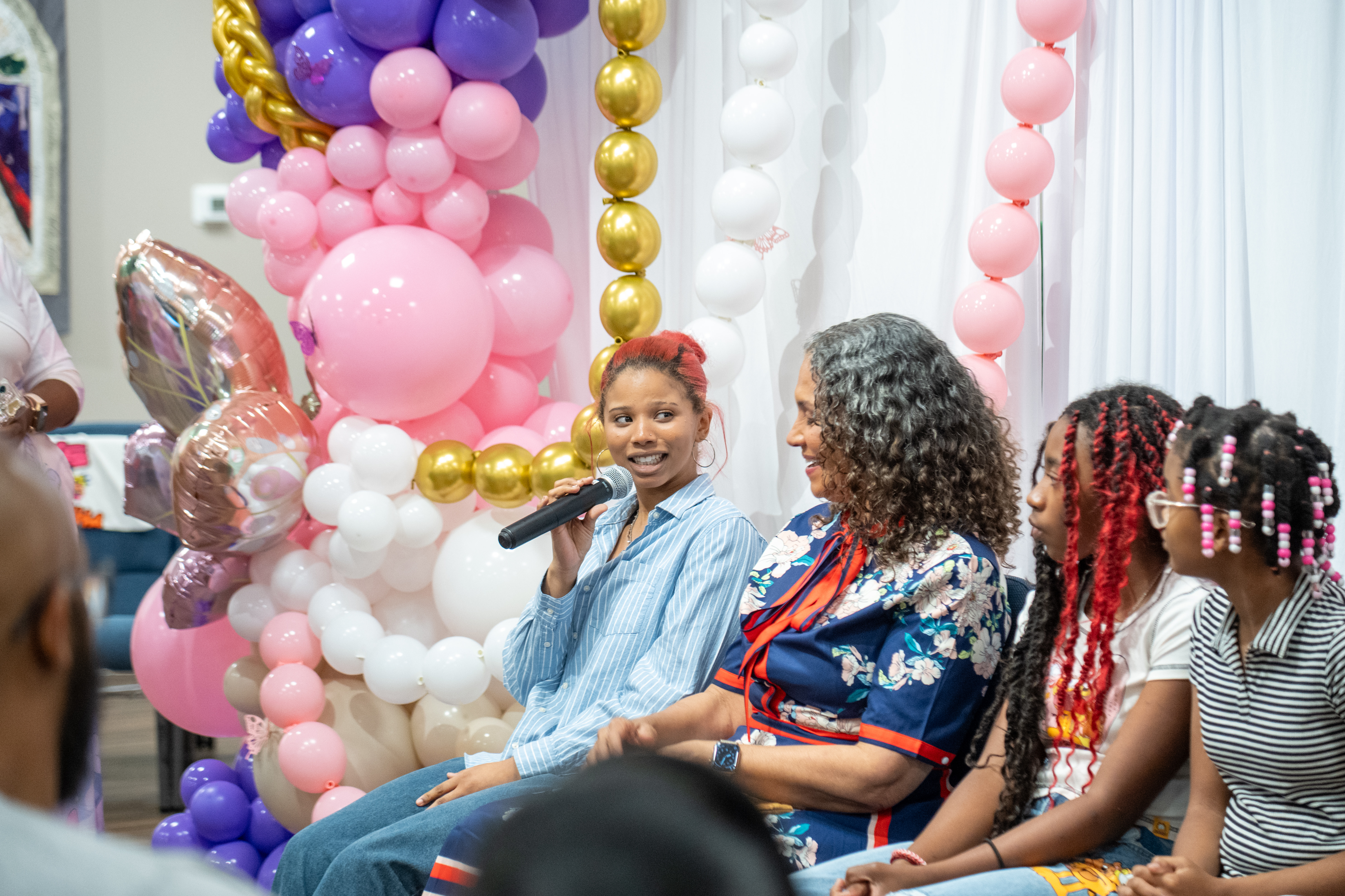 FLY Girl graduates holding their certificates at a celebration