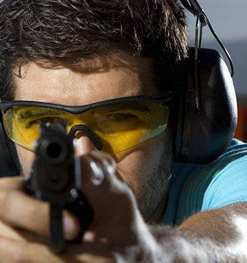 Shooter sighting a pistol during a range session