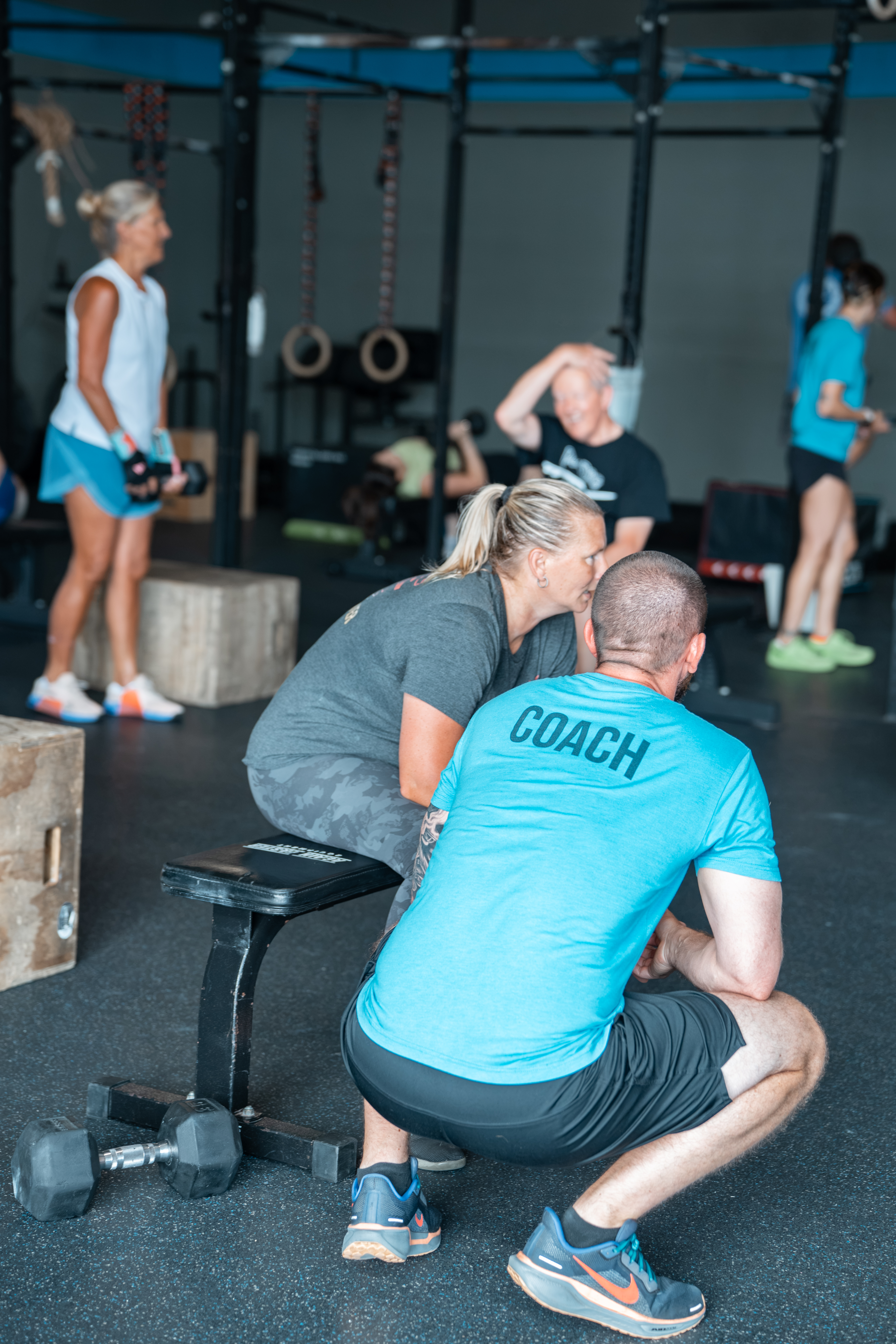 Somnium Fitness coach working with a member