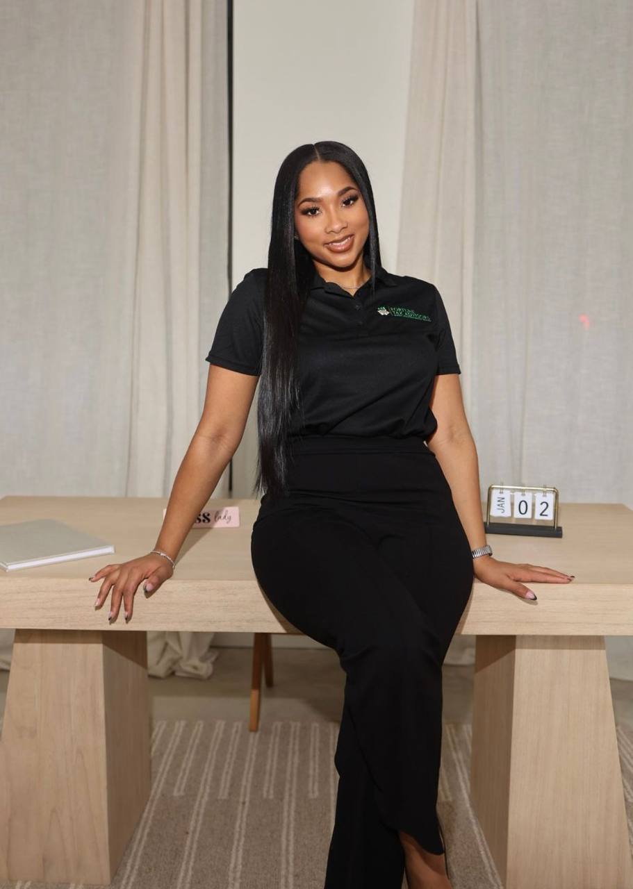 A Fortune Tax Advisors strategist sitting on the edge of her desk