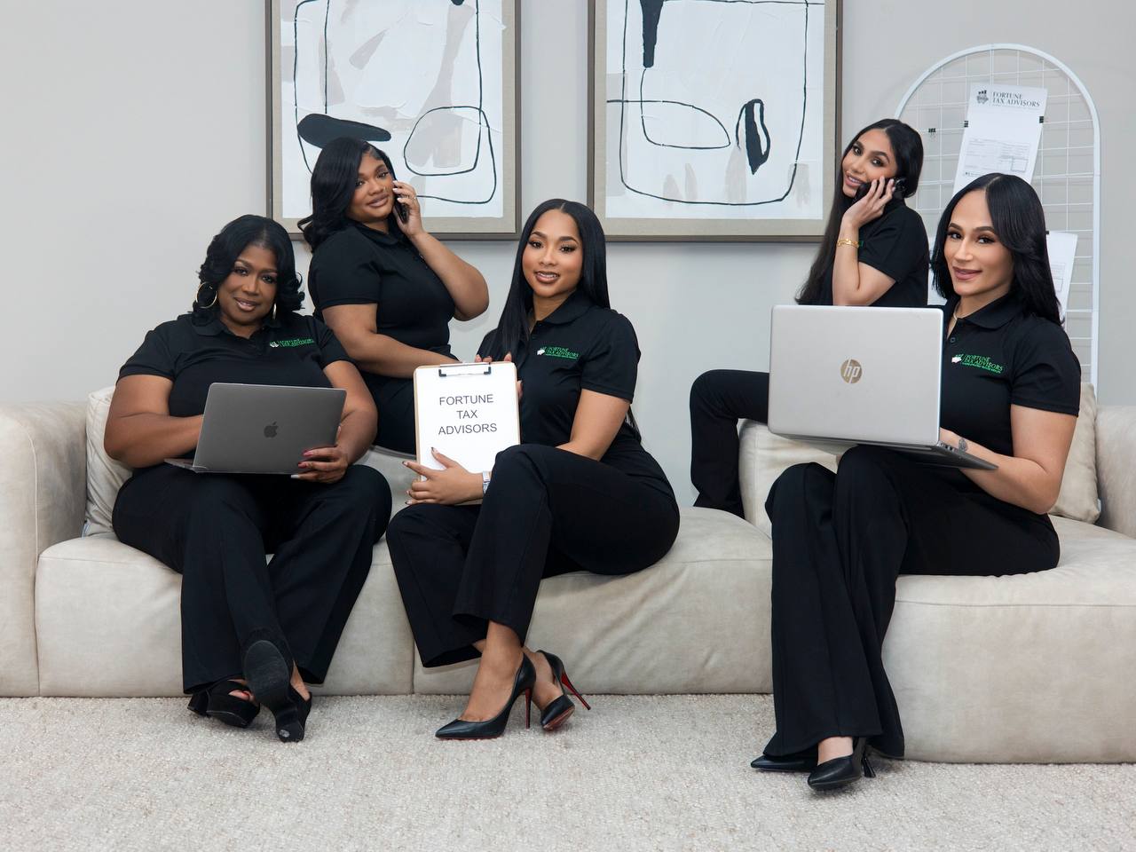 The Fortune Tax Advisors team working on laptops and phones together