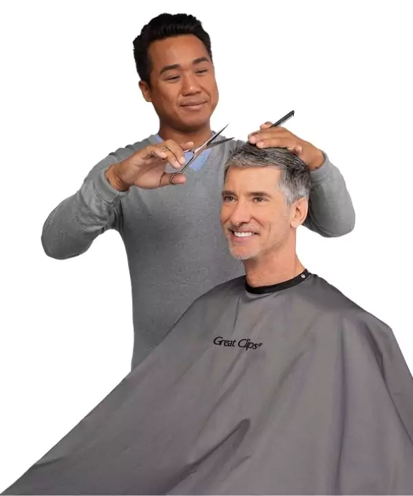 Licensed stylist cutting a client’s hair at Ten Sails Salons, showcasing flexible schedules, transparent pay, and growth opportunities in Maryland and Delaware.