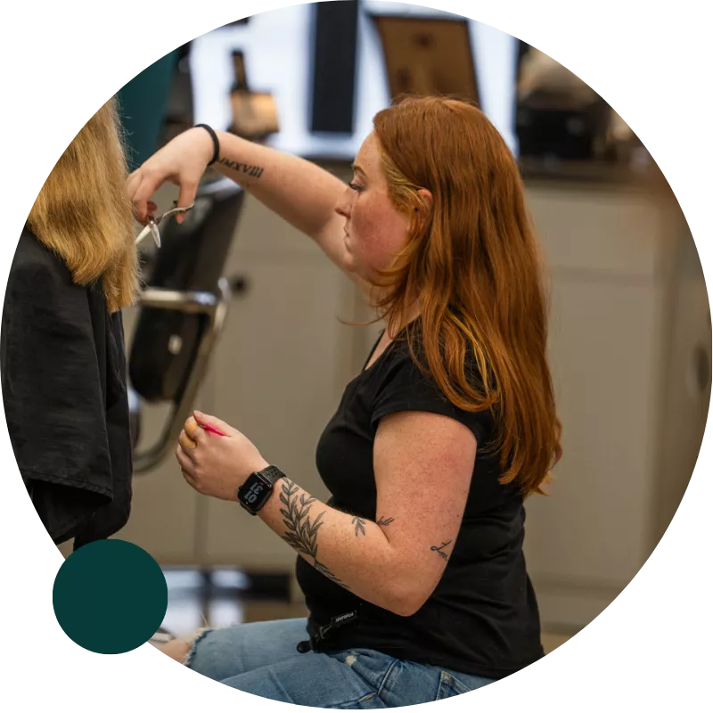 Hairstylist cutting client’s hair at Ten Sails Salons, an award-winning Great Clips team