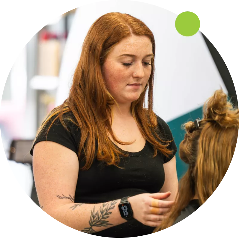 Experienced hairstylist at Ten Sails Salons working with a client, part of the Founders Club