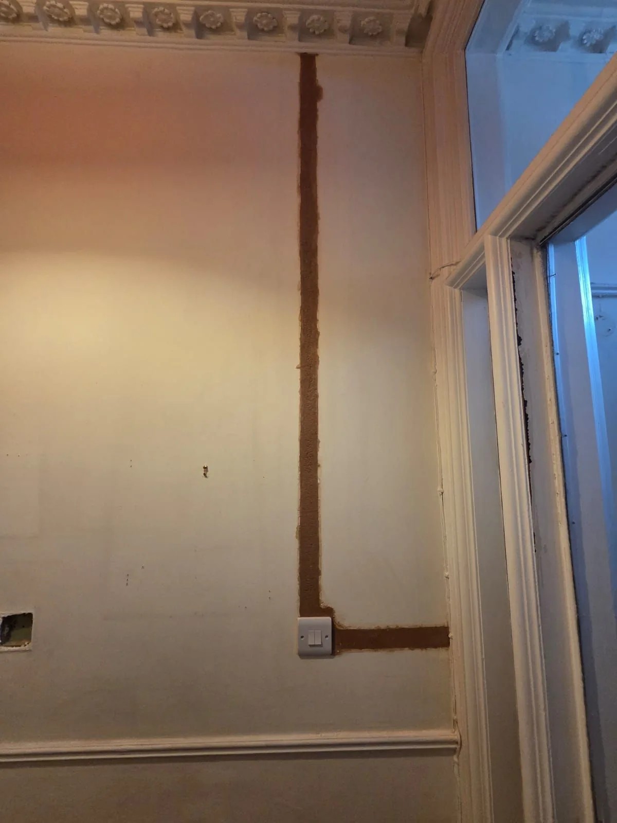 Cable route and new socket position in a plastered wall