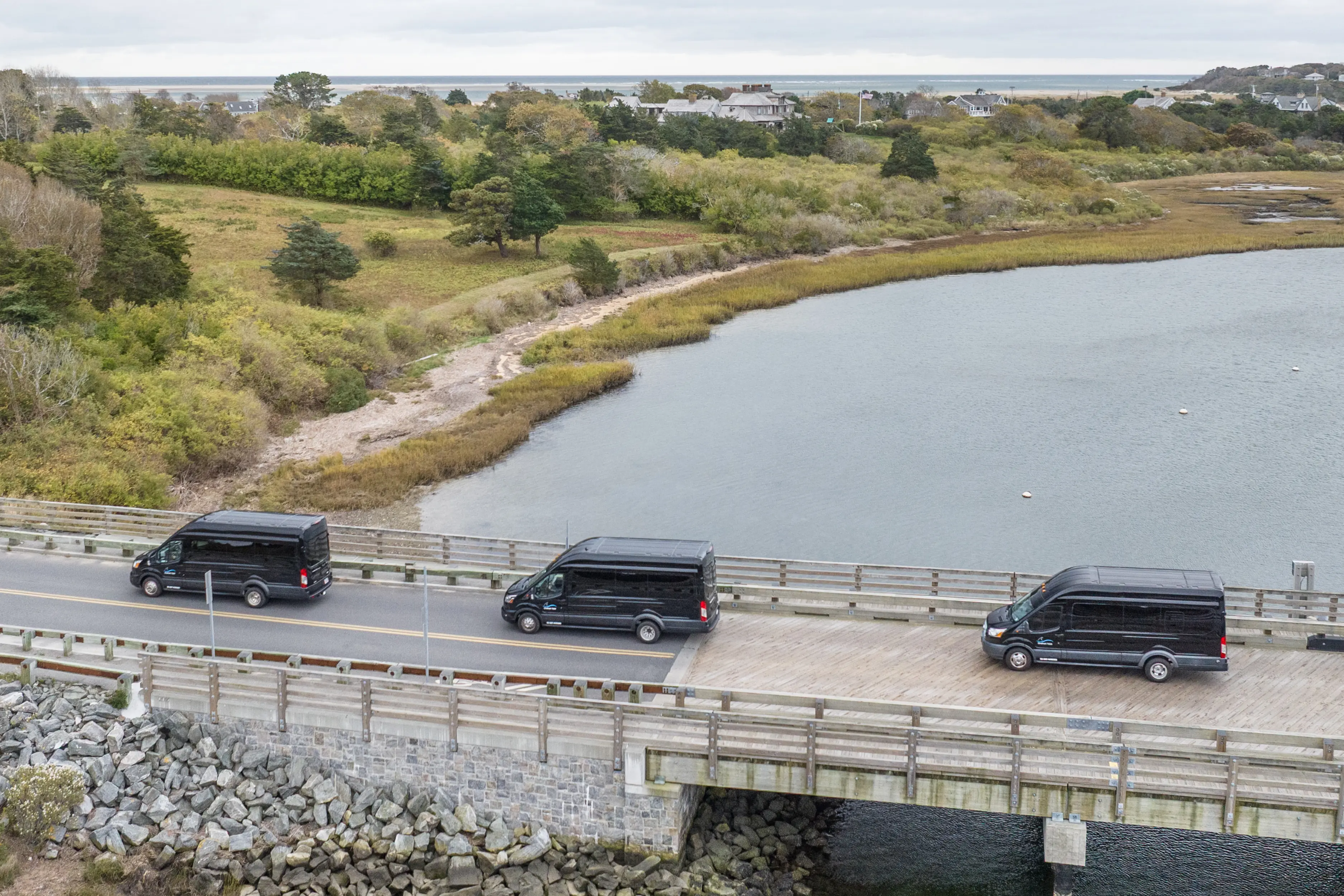 Shuttle bus traveling through a Cape Cod village