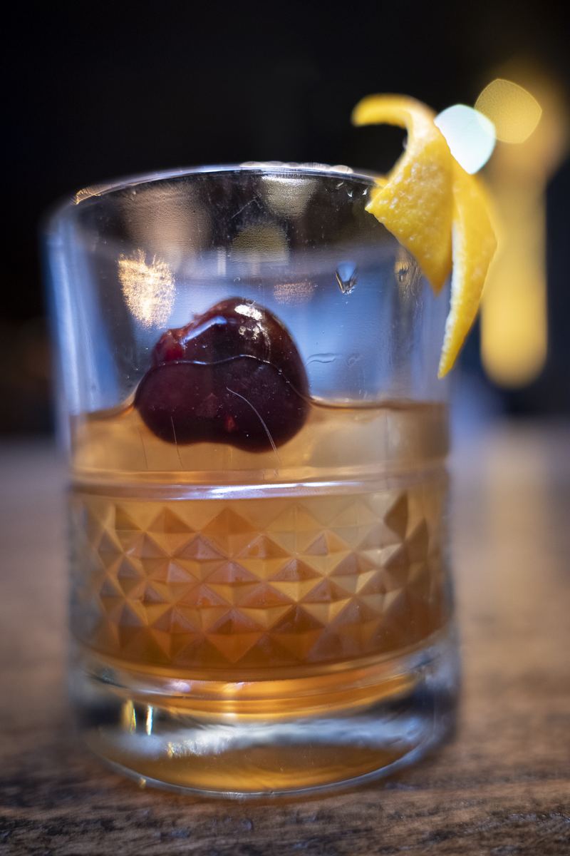 An old fashioned with a cherry