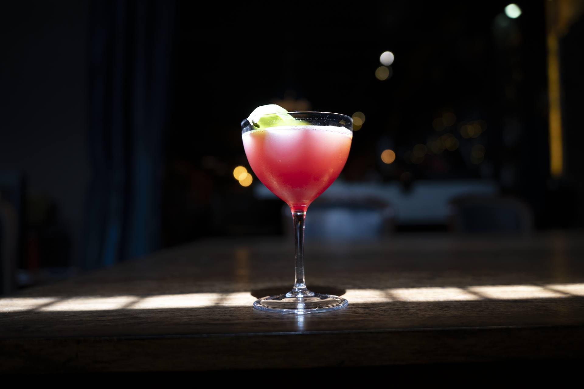A cocktail in window light at a Syracuse bar, shot by Trade Skill Growth