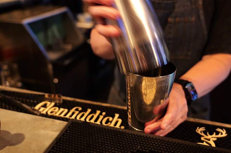 Cocktail being poured at The Whiskey Coop