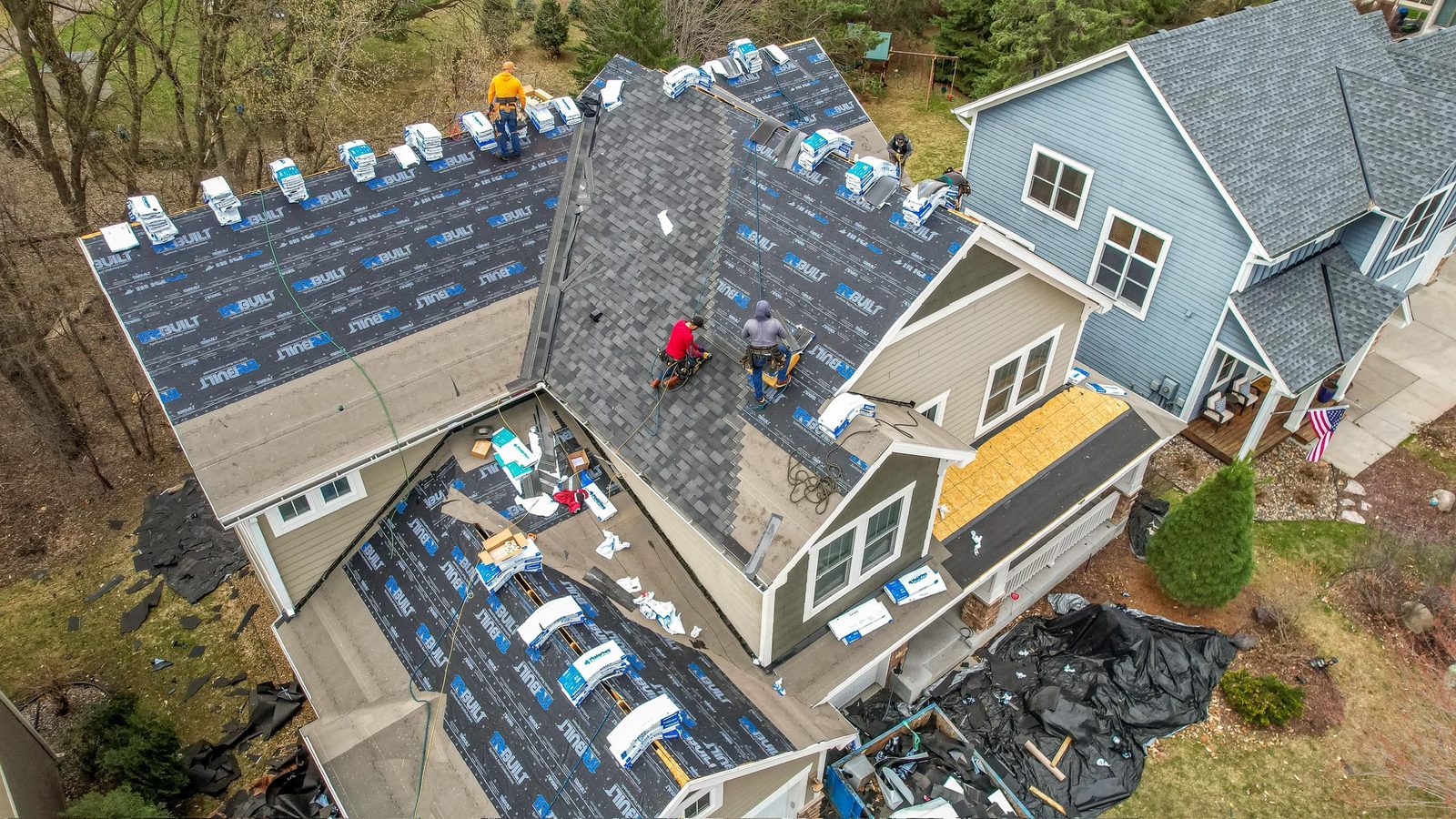 Charter roofing crew installing a new roof