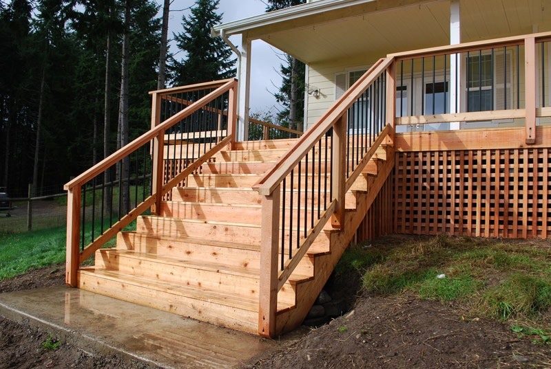 Cedar porch stairs with black balusters
