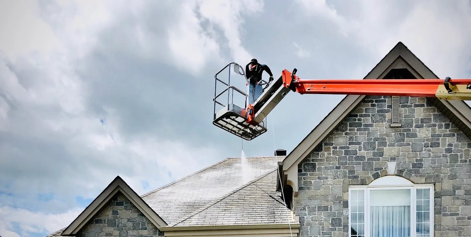 GoNano roof treatment being applied from a lift
