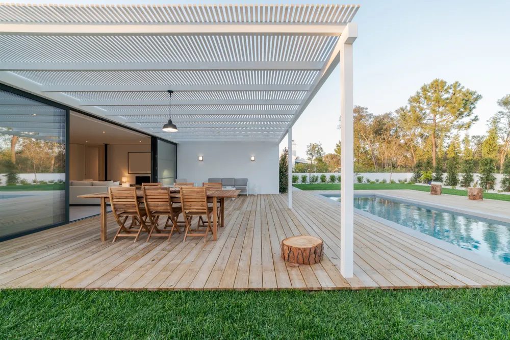 Wood deck and pergola by a pool