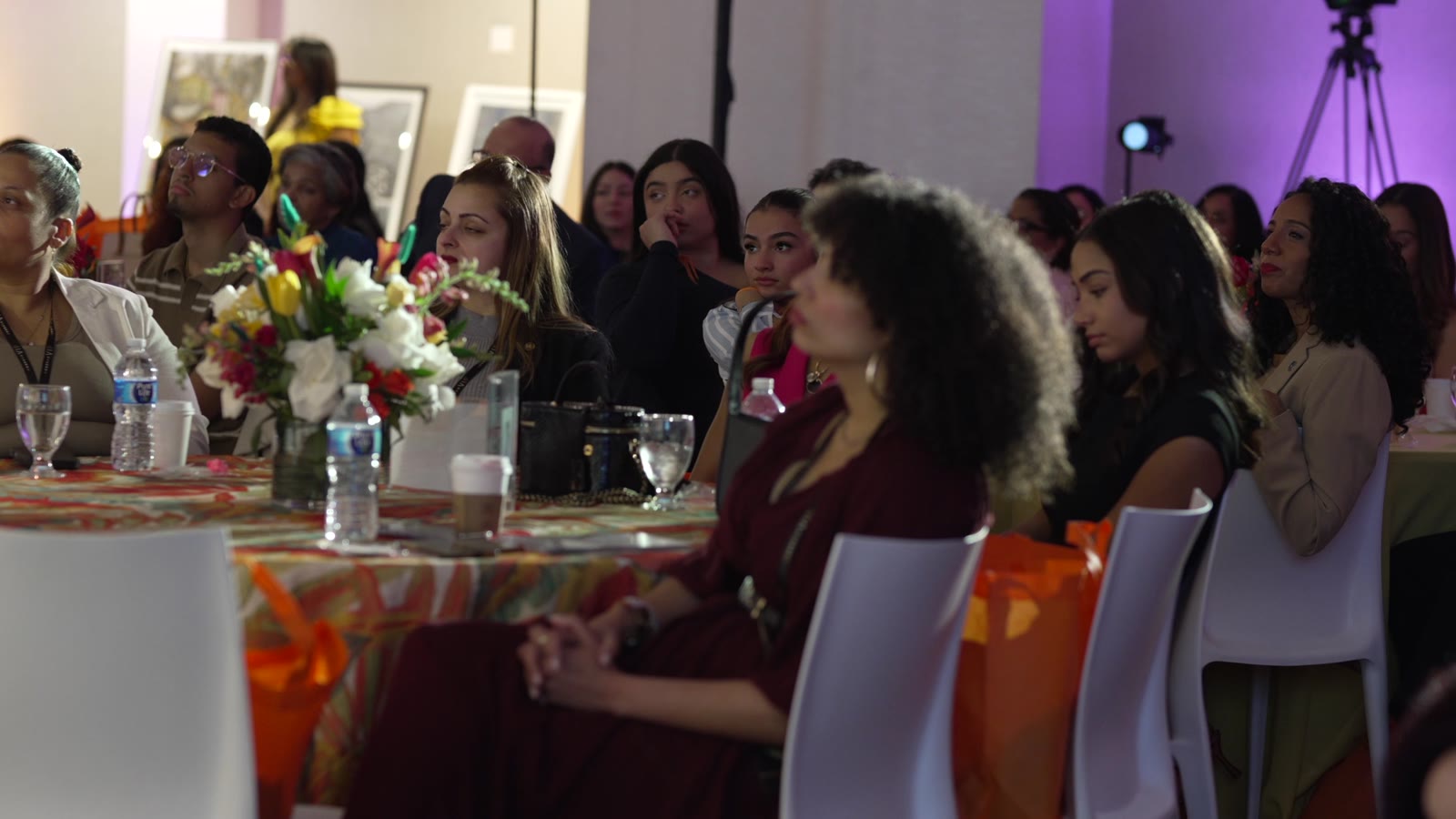 Women seated together, leaning in and listening during the 2026 Inspírame Latina Summit