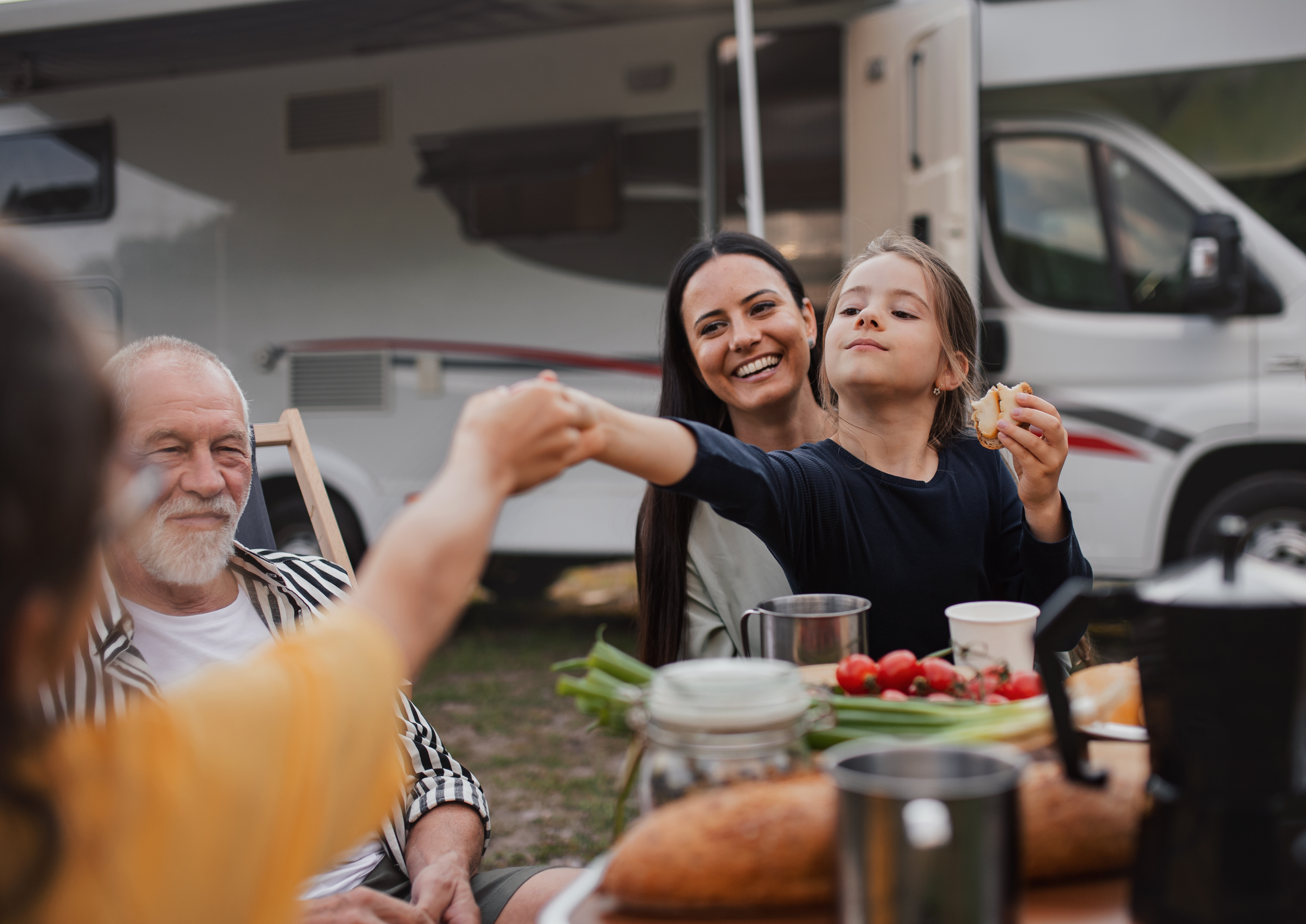 Family together beside a motorhome