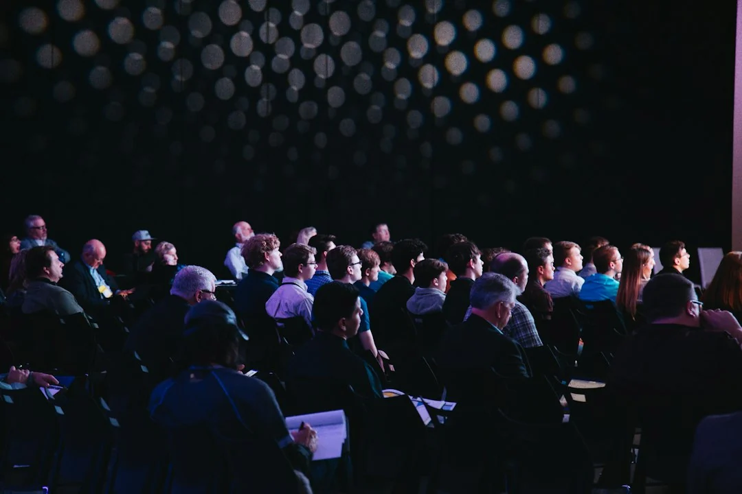Business attendees in conversation at an industry networking event