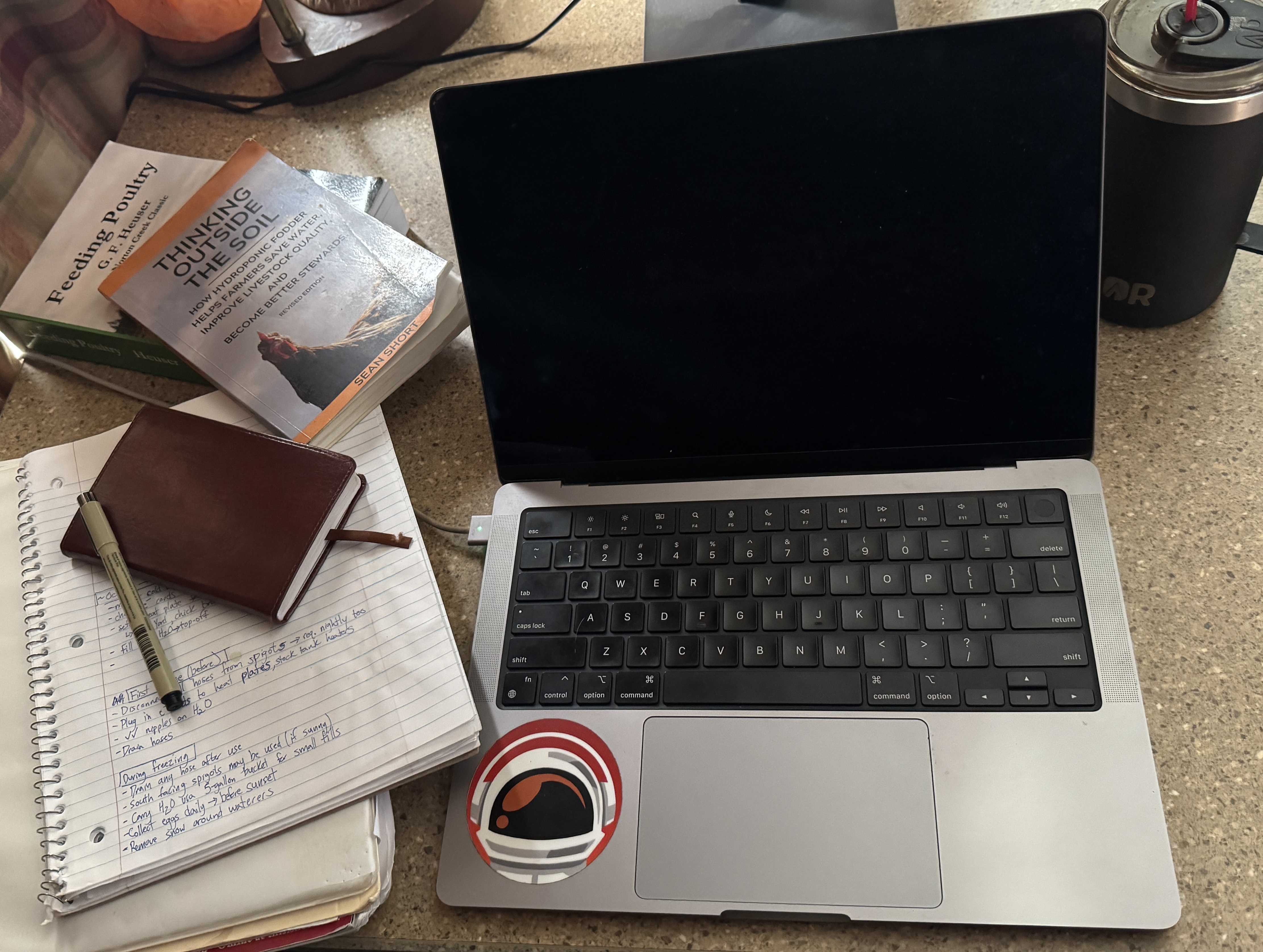 Sean Short writing at his workspace