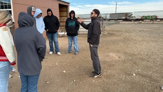 Sean Short speaking with young people at Blooming Health Farms
