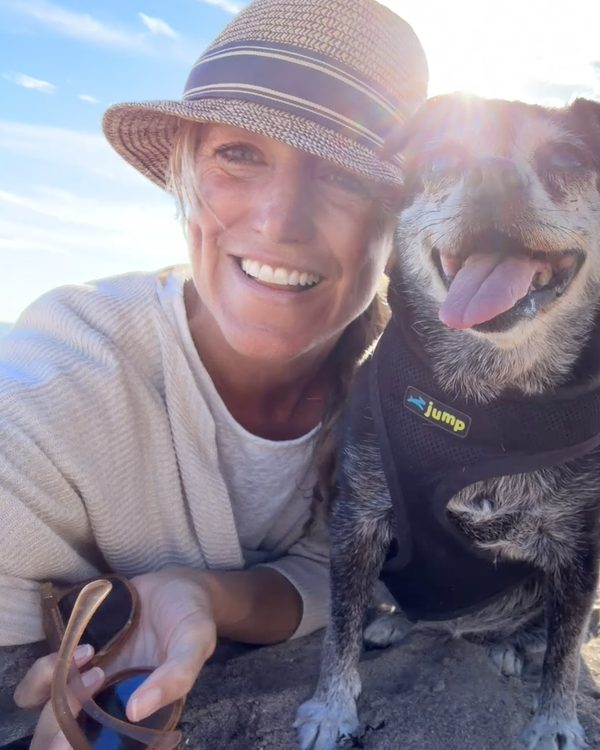Kate West with her dog at the beach