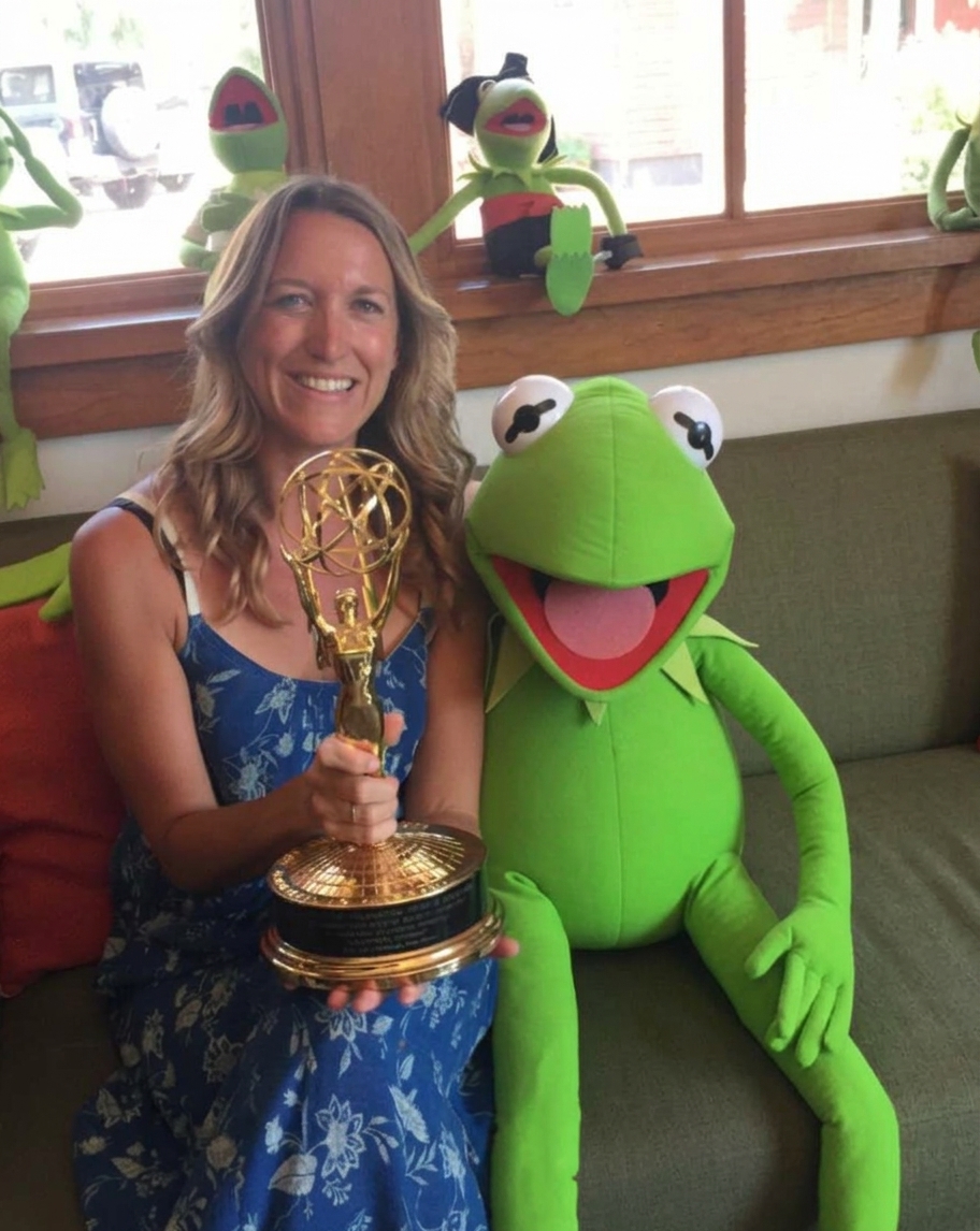 Kate West holding an Emmy with Kermit at the Jim Henson Company