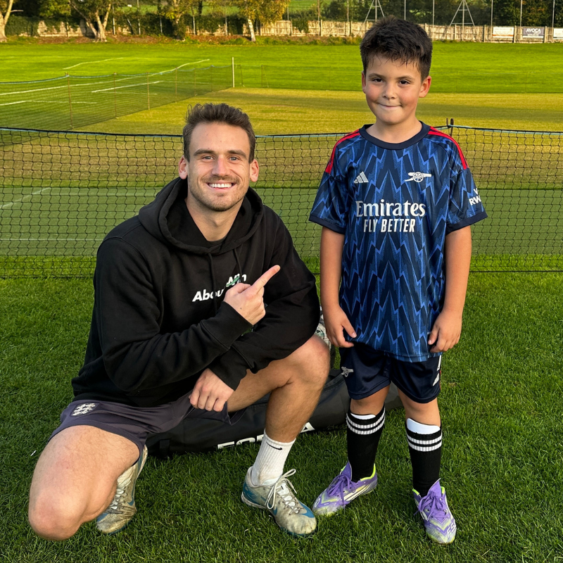 A player and Felix on the pitch at the end of a 1-to-1 session