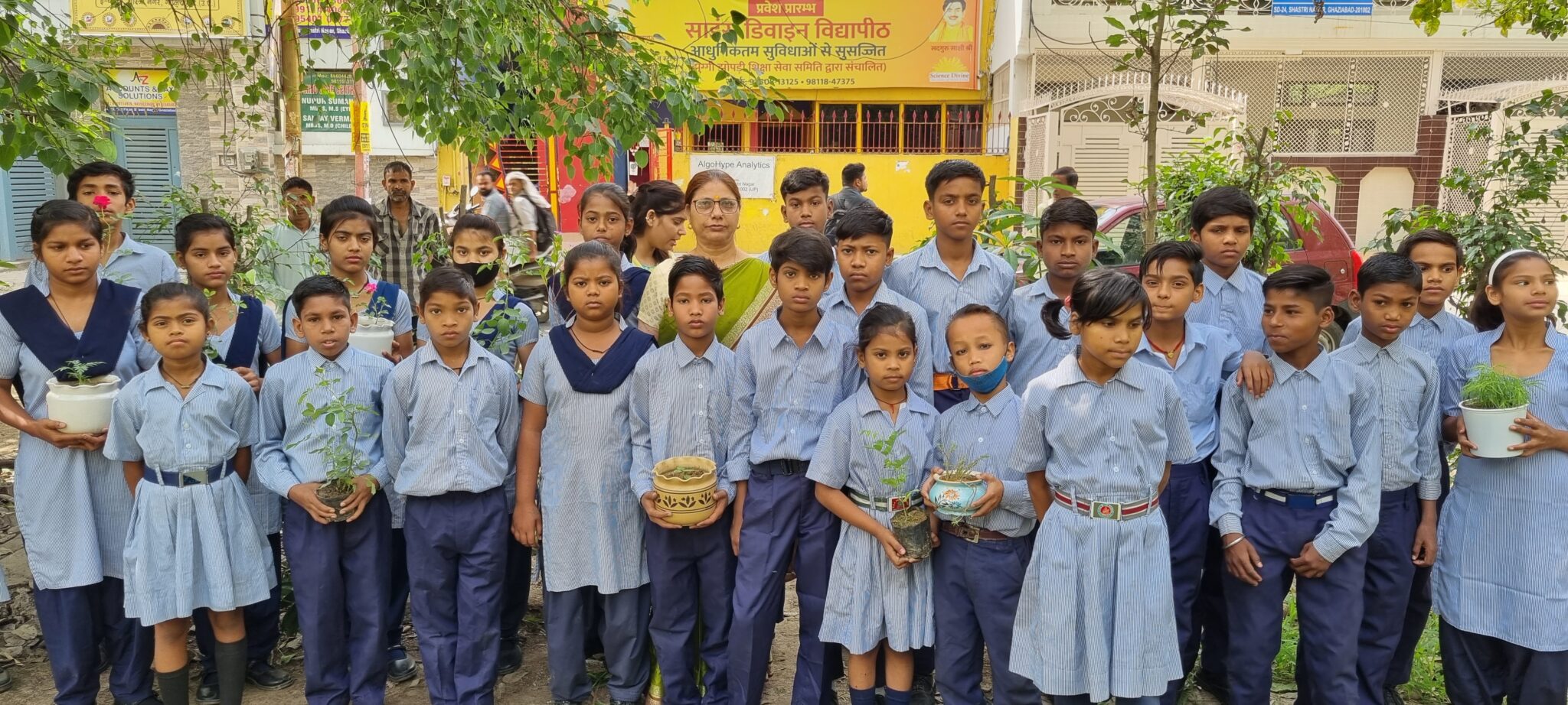 Student smiling and holding a book