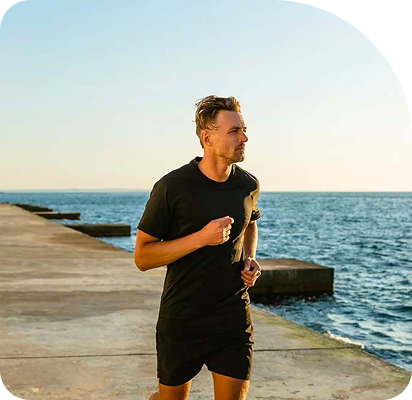 Man running outdoors showing physical vitality from NAD+ therapy