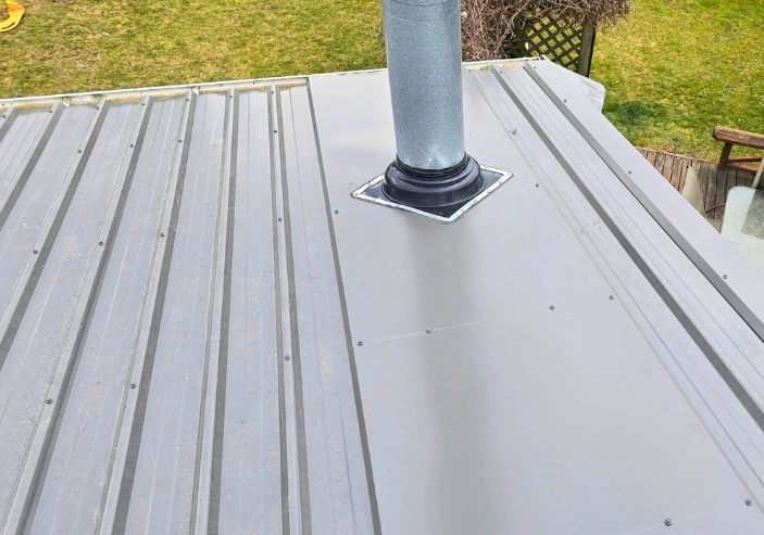 Roof cleaning and maintenance to protect longrun iron roofing year-round