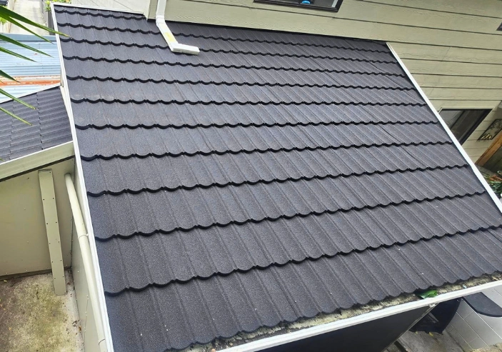 Finished roofing work showing clean lines and quality installation