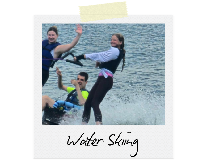 Three participants water skiing.
